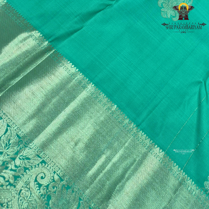 A refreshing sea green / aqua green shade with a soft, elegant silk sheen Saree