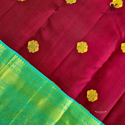 A rich Wine Magenta / Deep Rani Pink body with a contrasting Turquoise Blue Korvai Border Saree