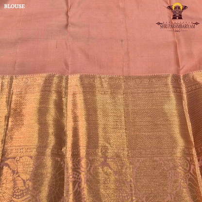A royal blue with a lavender purple border and rich rose gold zari Saree
