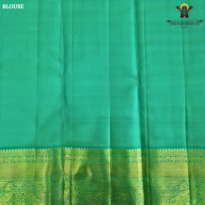 A rich Wine Magenta / Deep Rani Pink body with a contrasting Turquoise Blue Korvai Border Saree