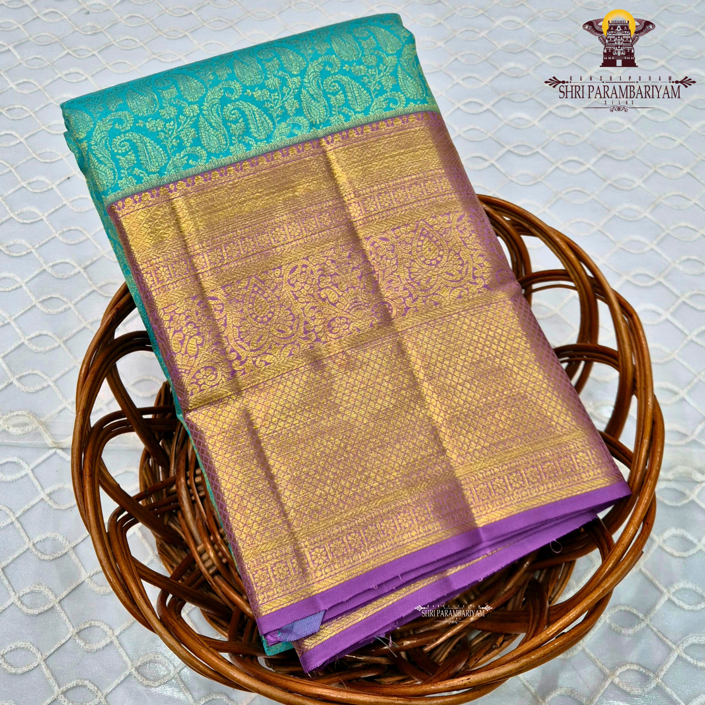 A rich turquoise blue (peacock blue) body, contrasted Saree