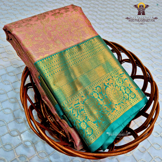 A soft dusty rose / blush pink Tissue Saree