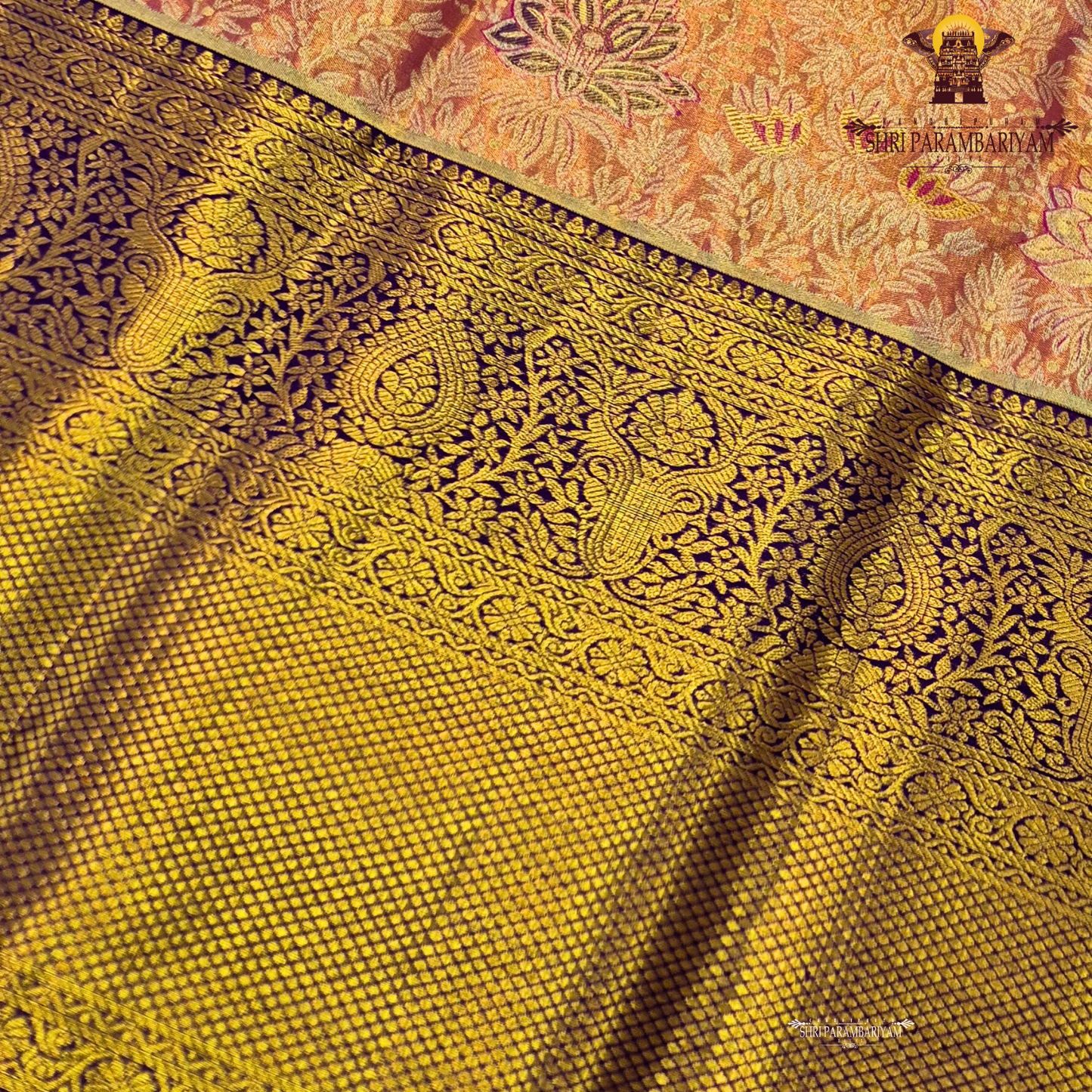 A rich combination of peachy orange body paired with a striking royal purple border Saree