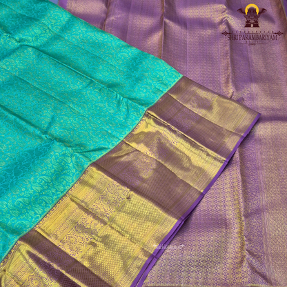 A rich turquoise blue (peacock blue) body, contrasted Saree