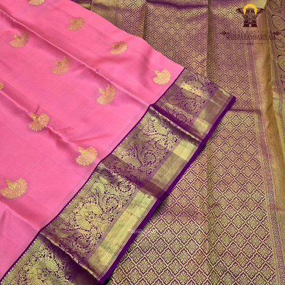 A delicate baby pink body adorned with elegant Saree