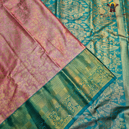 A soft dusty rose / blush pink Tissue Saree