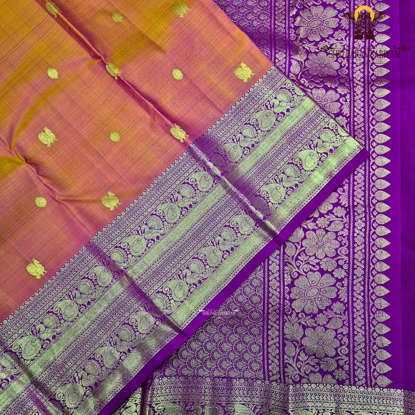A vibrant orange with a rich gold zari border and a contrasting rani pink (magenta) edging Saree