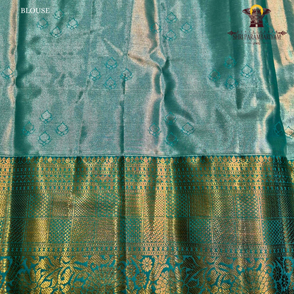 A soft dusty rose / blush pink Tissue Saree