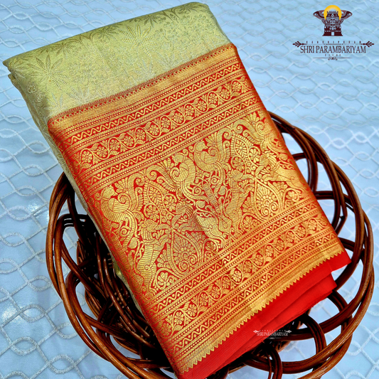 Elegant mint green / pastel pista green (Half White) with a soft golden tissue shine Saree