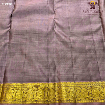 Elegant Dusty Green / Sage Green body with rich gold zari buttas, paired with a mustard gold zari 2-inch traditional border and subtle mauve selvedge edging Saree