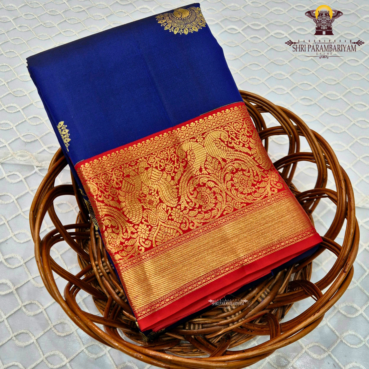 A rich royal blue body highlighted with delicate Saree