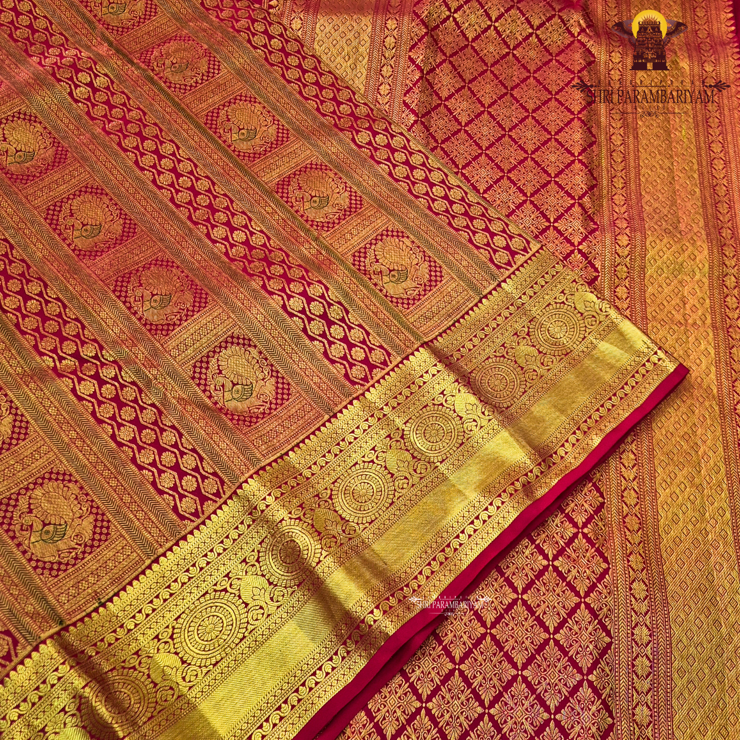 Bright vermilion red with rich antique gold zari accents Saree