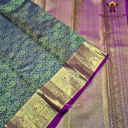 A rich black (or very deep navy) body with an opulent antique gold zari weave, paired with a contrasting rani pink Saree