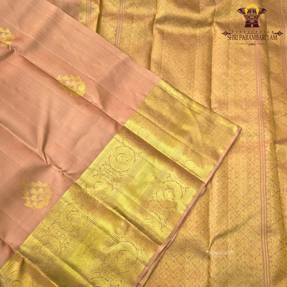 A elegant Soft Peach with Rich Gold Zari Saree