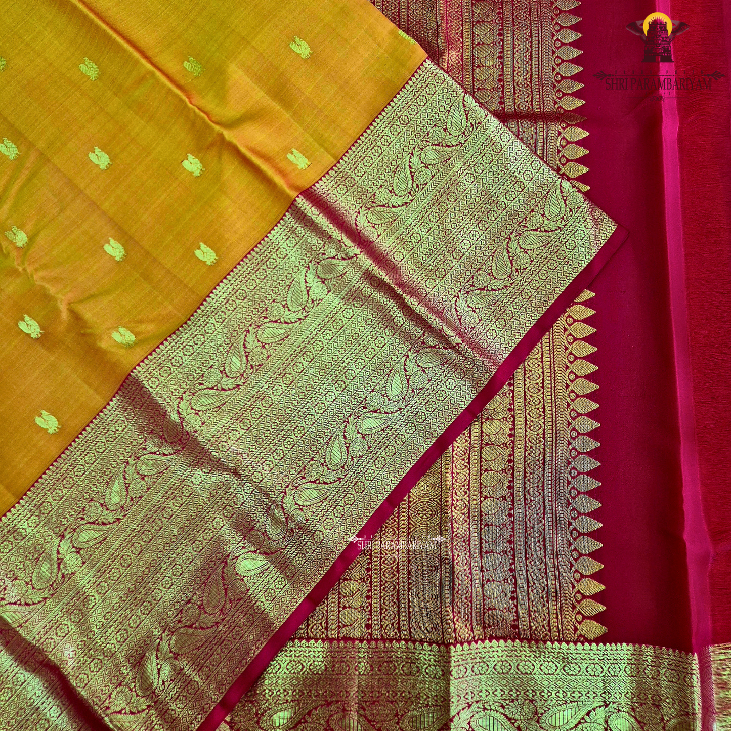 A golden Orange / Mango Orange with Rich Red and Gold Zari Border Saree