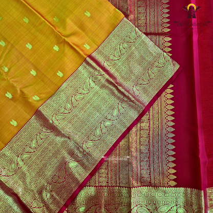 A golden Orange / Mango Orange with Rich Red and Gold Zari Border Saree