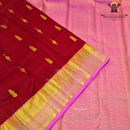 Elegant Deep Maroon body with a rich Pink border and pallu Saree
