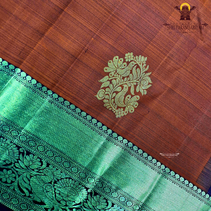 A vibrant brick red body with a rich gold zari border and pallu Saree