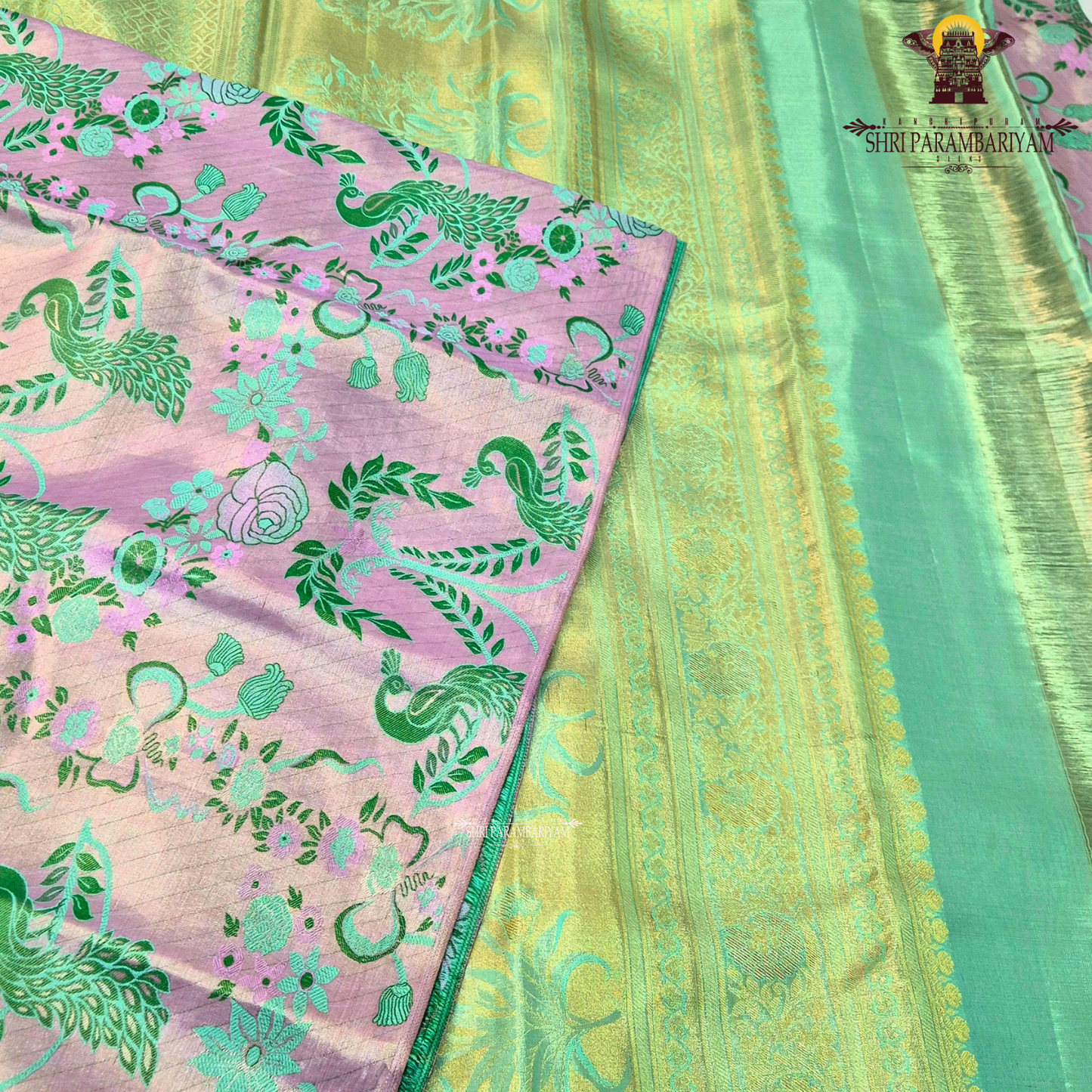 Soft pastel lavender-pink base with contrasting Saree
