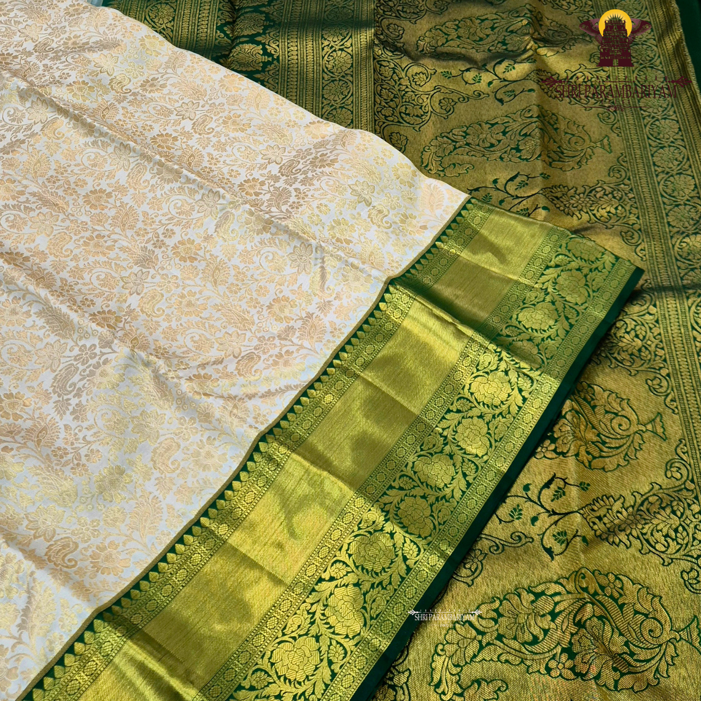 Soft half white (ivory/off-white) body with bottle green contrast border Saree