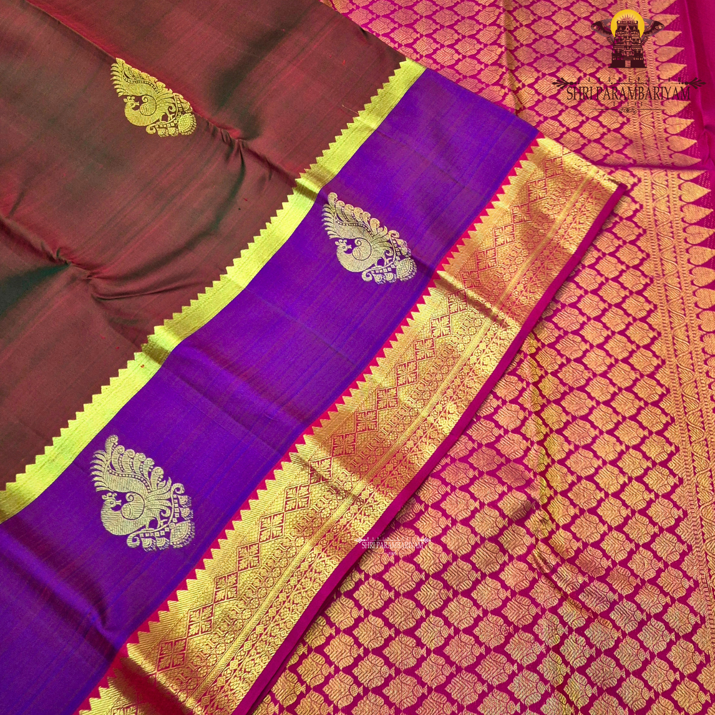 A classic tri-tone rusty maroon, royal purple, and deep pink (rani) Saree