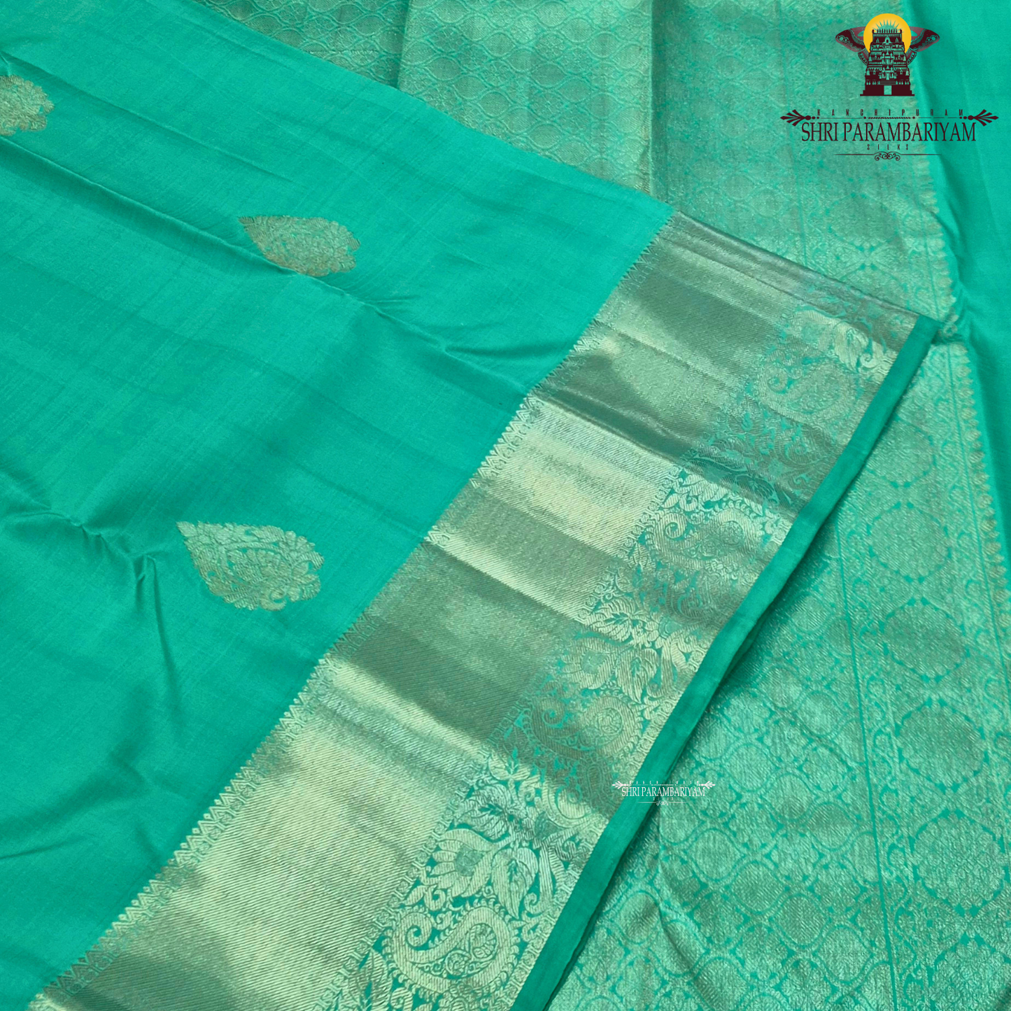 A refreshing sea green / aqua green shade with a soft, elegant silk sheen Saree