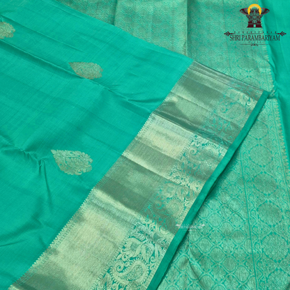 A refreshing sea green / aqua green shade with a soft, elegant silk sheen Saree