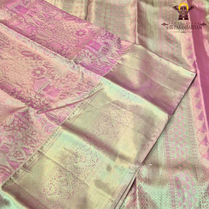 A graceful rose pink shade blended with antique gold tissue weaving Saree