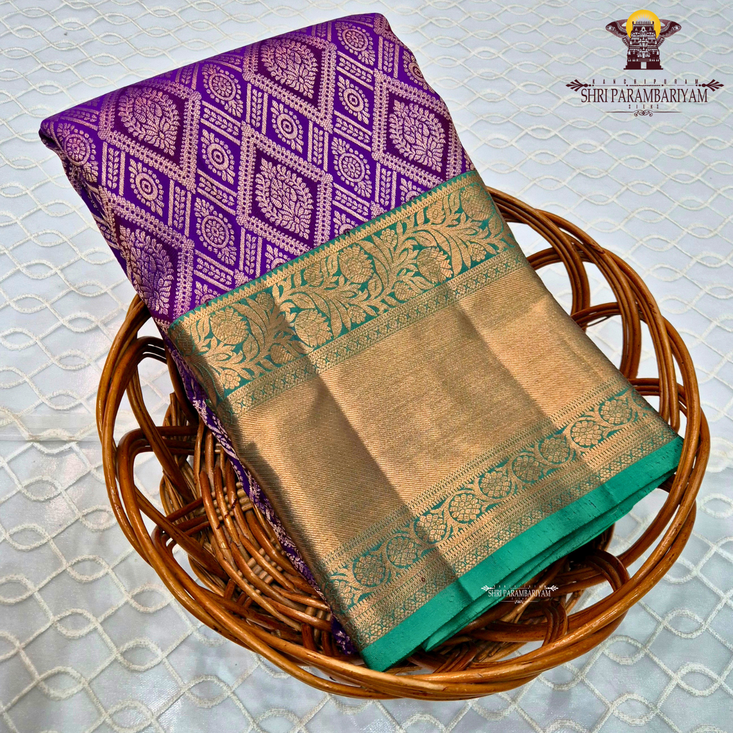 A rich royal purple body, paired with a contrasting emerald green korvai border Saree