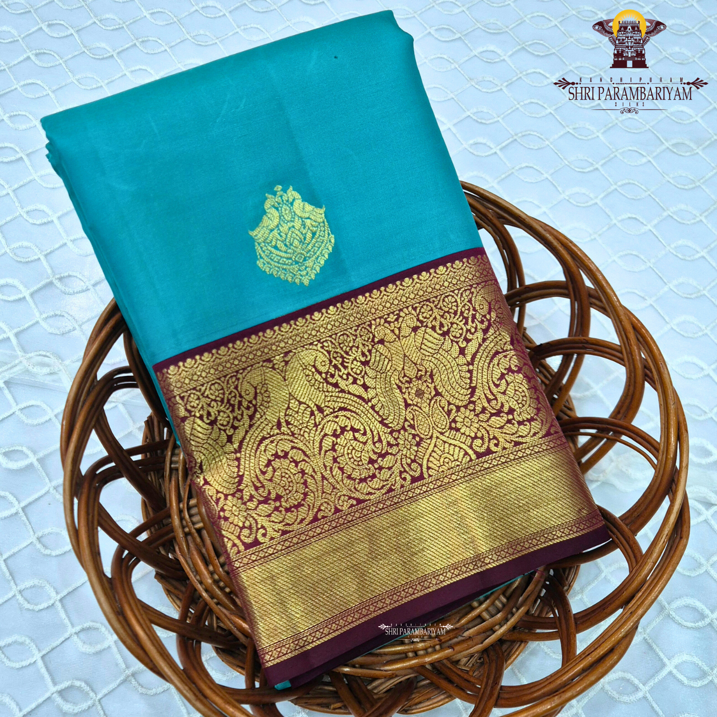 A Vibrant turquoise blue (peacock blue) body beautifully highlighted Saree