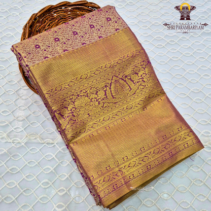 Rich antique gold with deep magenta / purple accents Saree