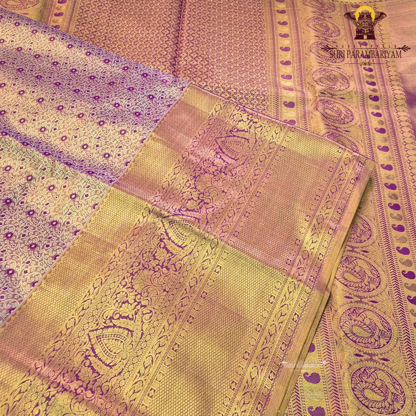Rich antique gold with deep magenta / purple accents Saree