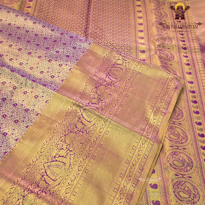 Rich antique gold with deep magenta / purple accents Saree
