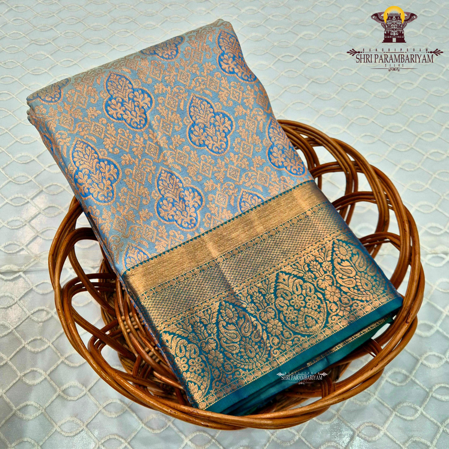 A soft pastel sky blue body, complemented by a contrasting teal blue korvai border Saree