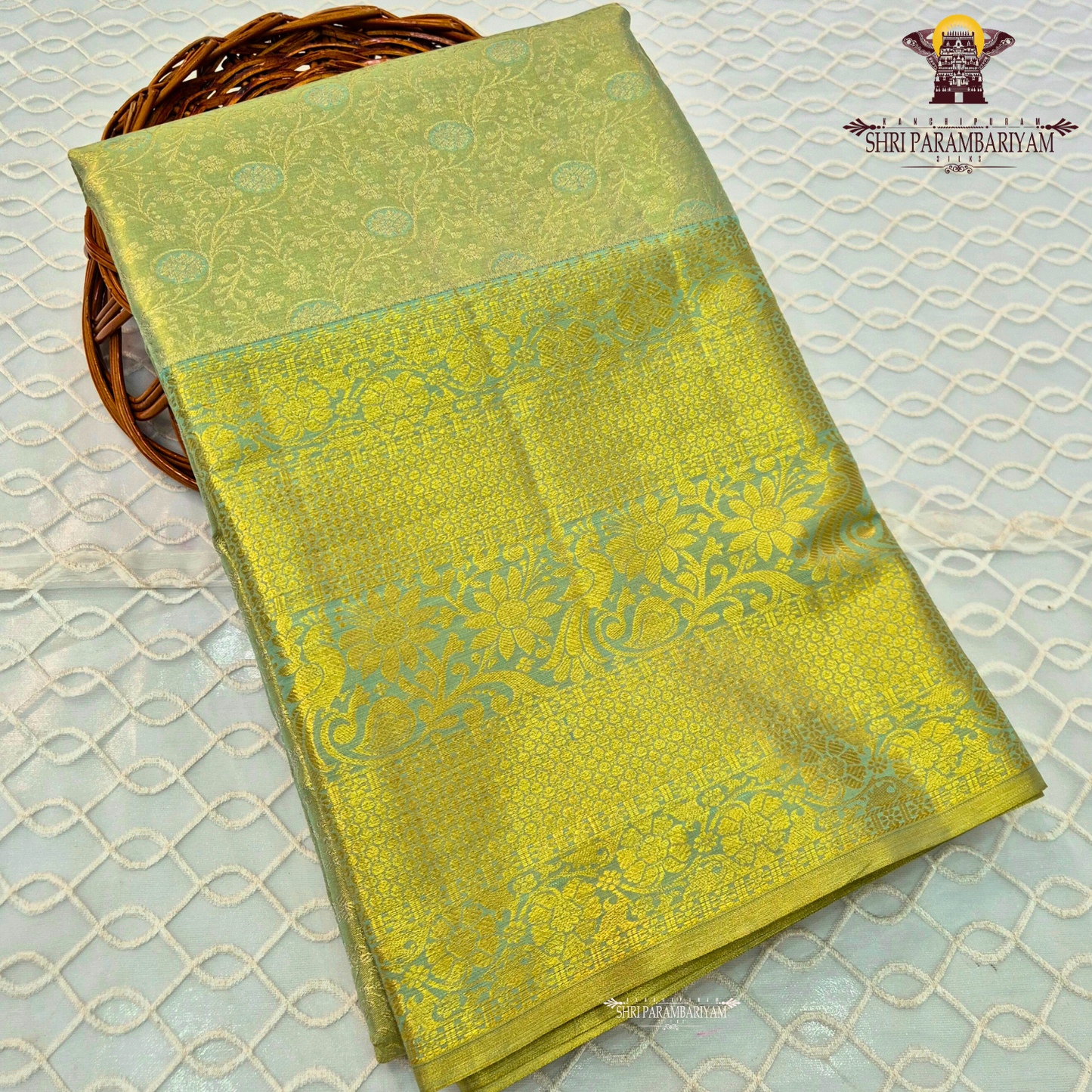 Pastel pista green with subtle aqua blue tones and rich golden zari Saree