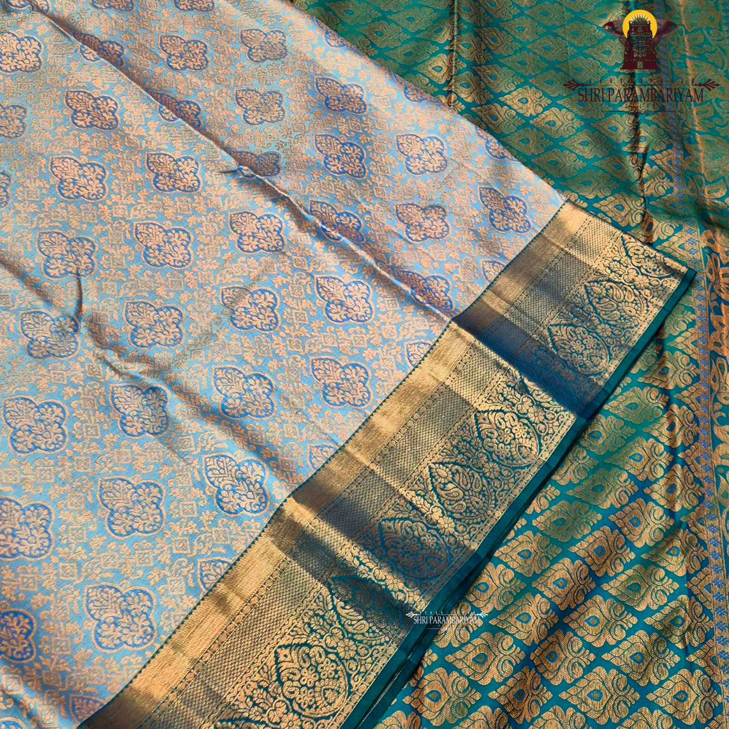 A soft pastel sky blue body, complemented by a contrasting teal blue korvai border Saree