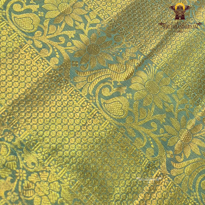 Pastel pista green with subtle aqua blue tones and rich golden zari Saree