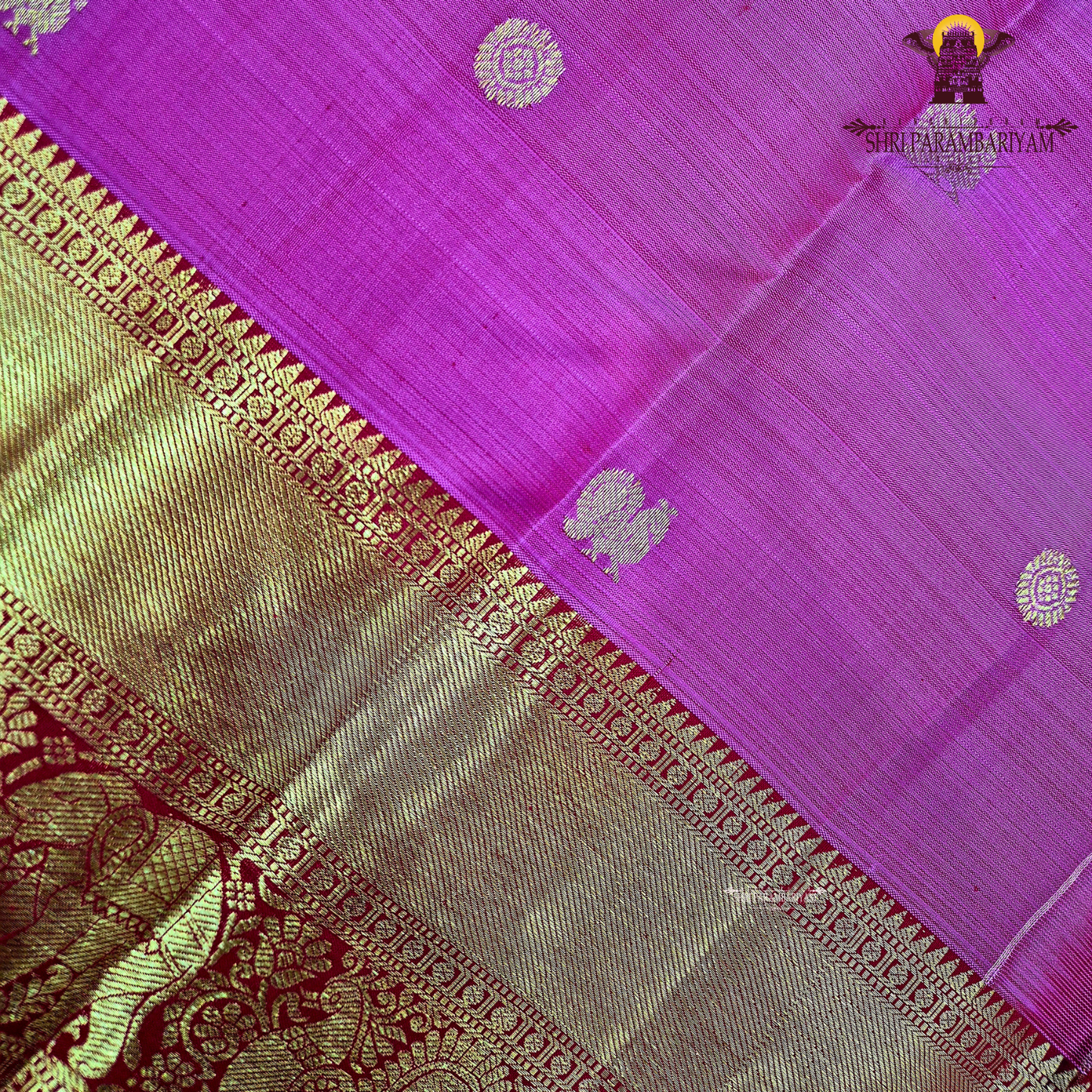 A bright rani pink with a rich red border Saree