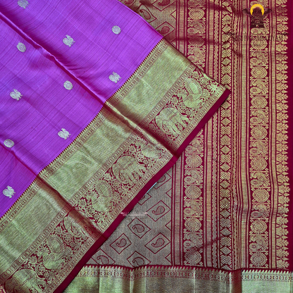 A bright rani pink with a rich red border Saree