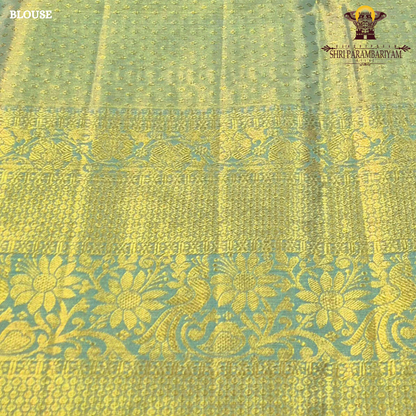 Pastel pista green with subtle aqua blue tones and rich golden zari Saree