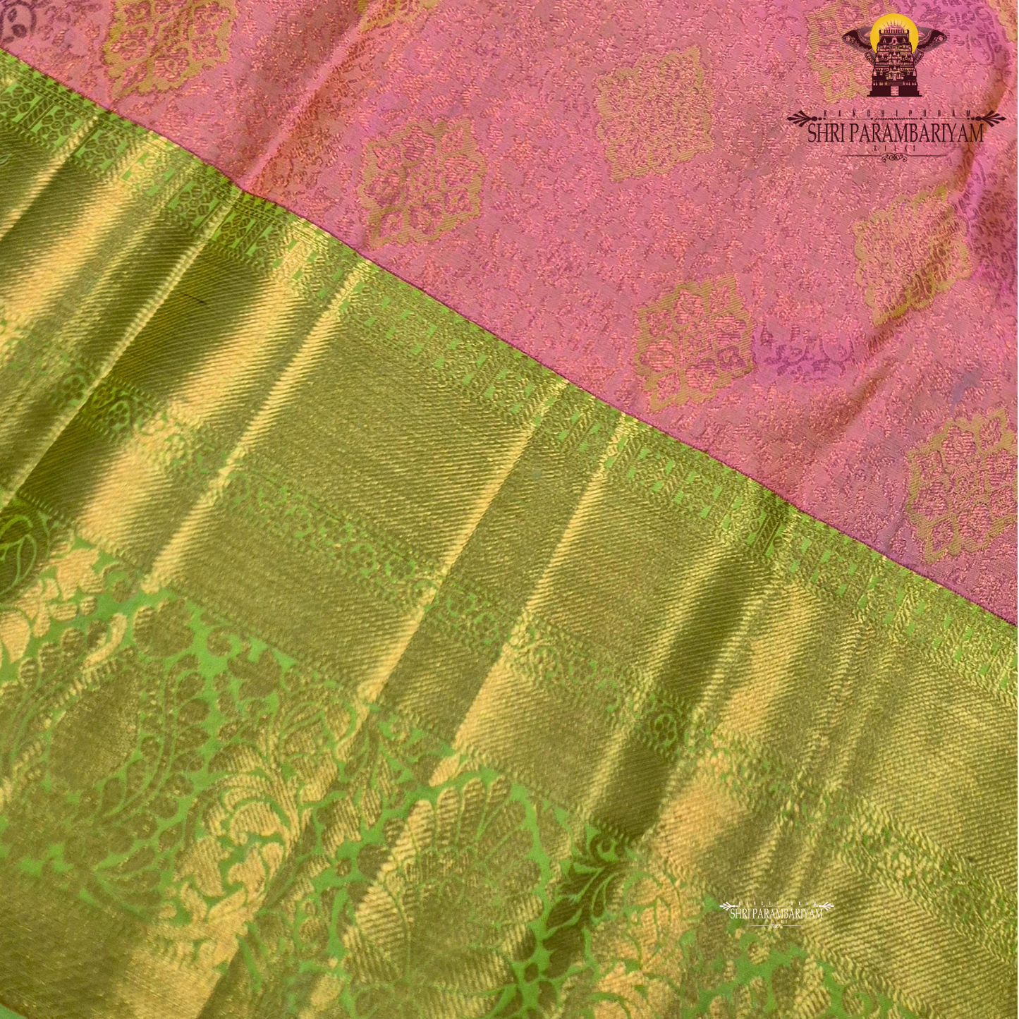 A soft rose pink body, paired with a refreshing parrot green korvai border Saree