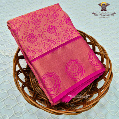 Warm peach-pink with a subtle tissue shimmer Saree