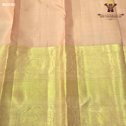 A elegant Soft Peach with Rich Gold Zari Saree