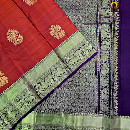 A vibrant brick red body with a rich gold zari border and pallu Saree