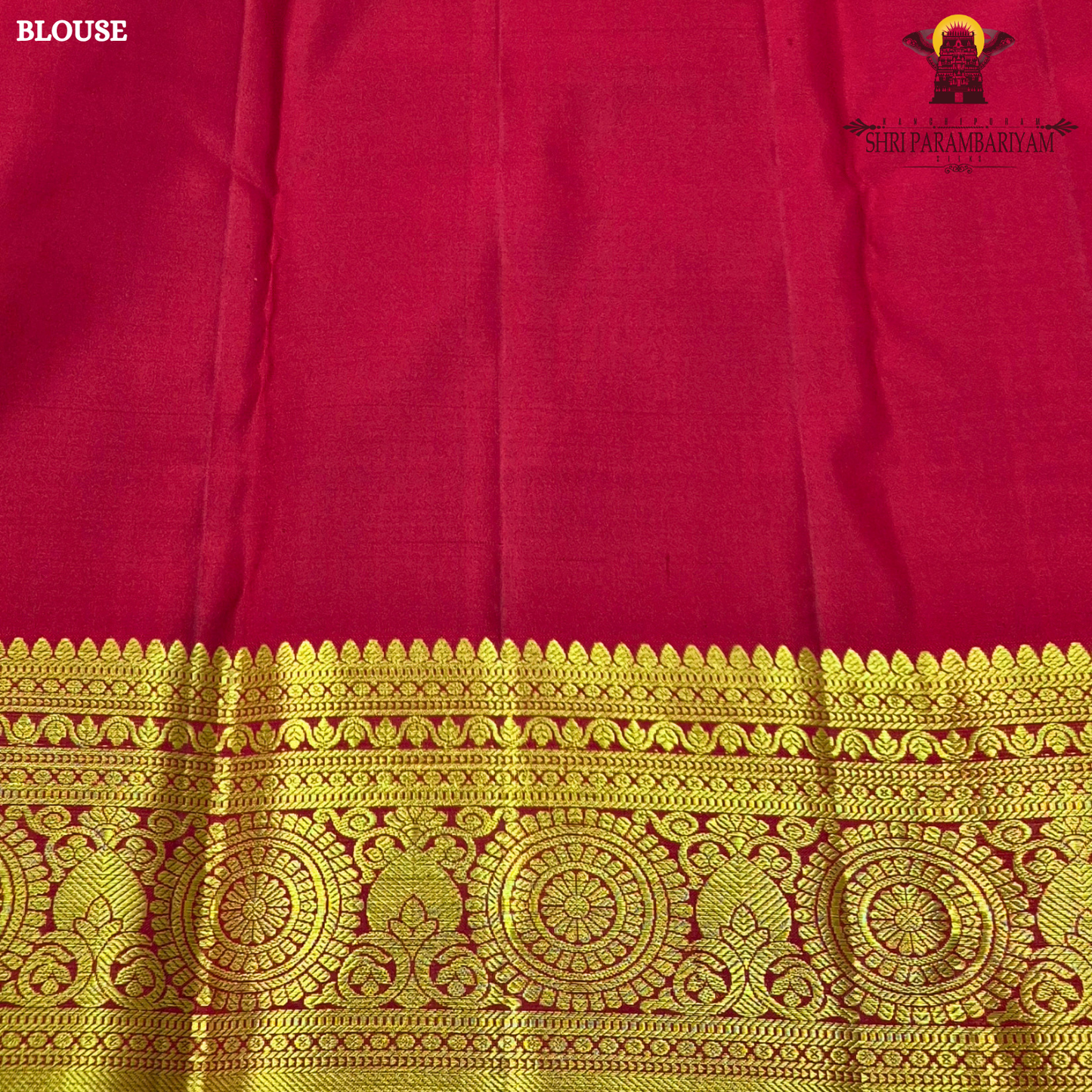 Bright vermilion red with rich antique gold zari accents Saree