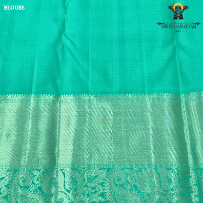 A refreshing sea green / aqua green shade with a soft, elegant silk sheen Saree