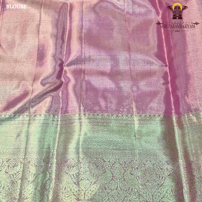 A graceful rose pink shade blended with antique gold tissue weaving Saree