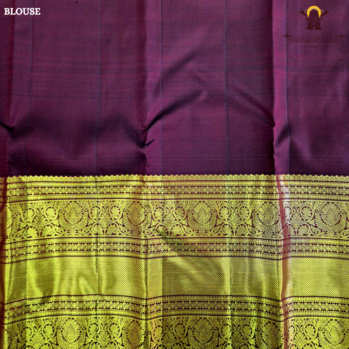 A rich wine maroon body with elegant gold zari butta Saree