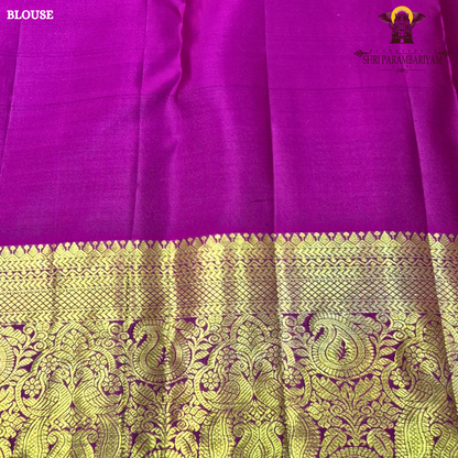 A rich black (or very deep navy) body with an opulent antique gold zari weave, paired with a contrasting rani pink Saree