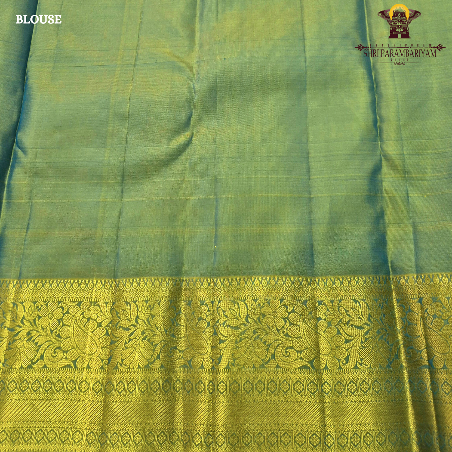 Vibrant royal blue with a rich gold zari border featuring a subtle green undertone Saree